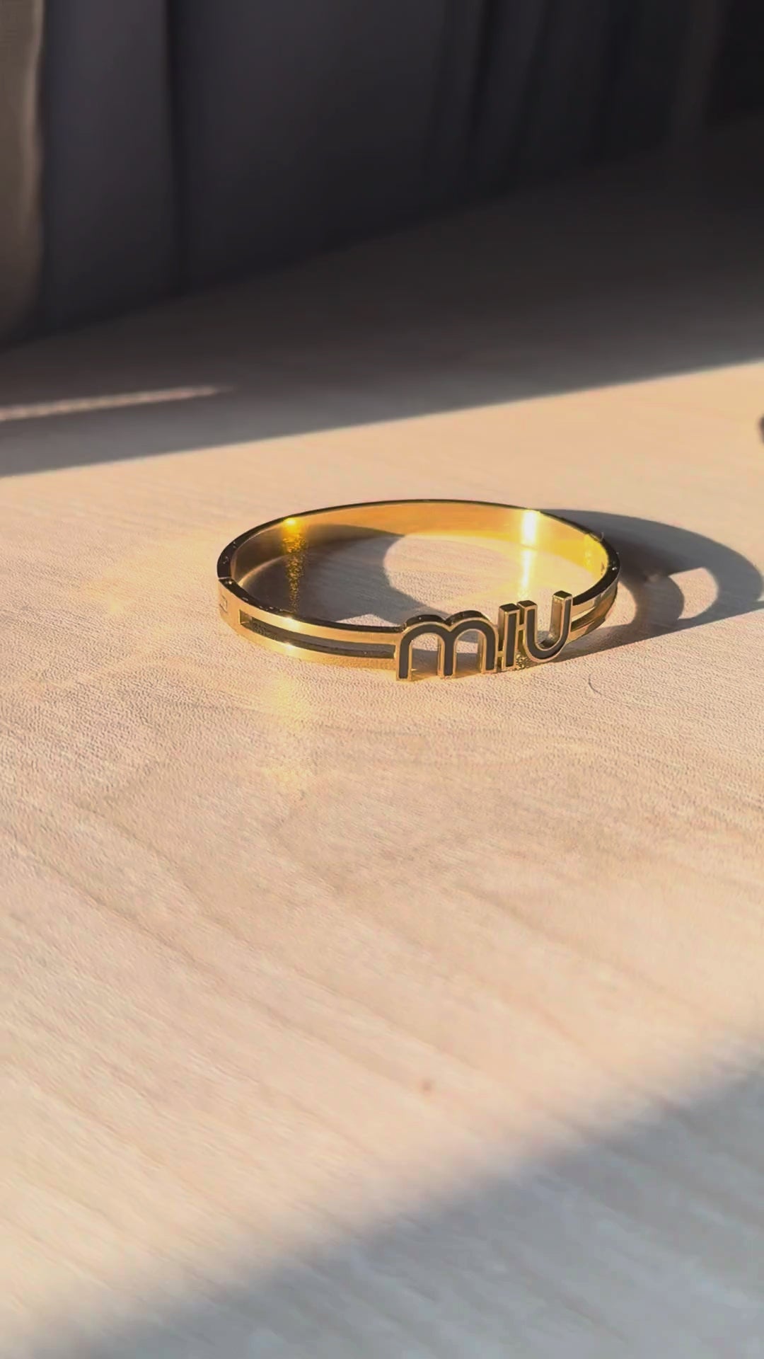 MIU Logo Black Enamel Bangle Bracelet